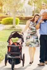 Mom and Dad with son and baby stroller